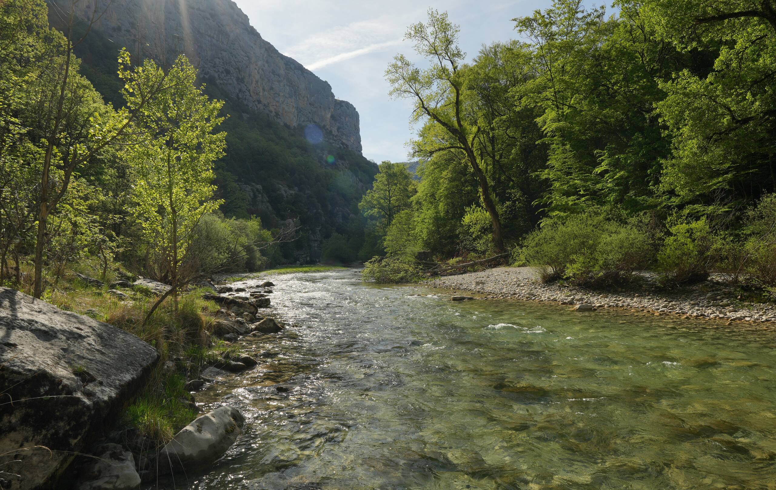 An image of river near bridge.